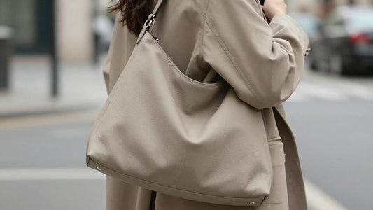 Woman with a chic slouchy shoulder bag on a city street.