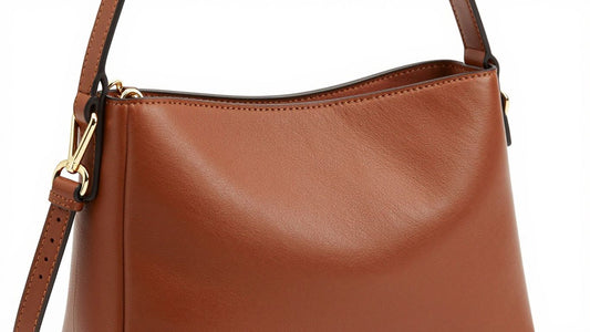 Compact brown leather crossbody mini bag with gold clasp.