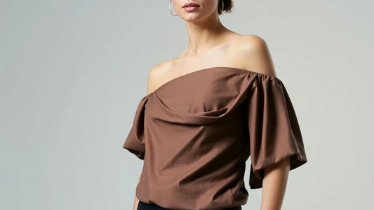 Model wearing a stylish asymmetrical top.