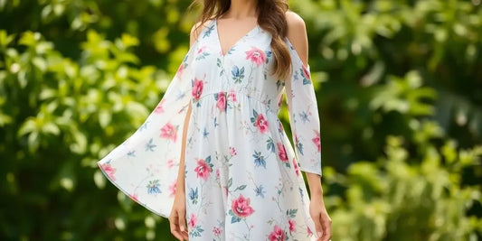 Woman smiling in a flowing floral casual dress.