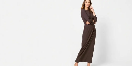 Woman wearing a long-sleeved midi dress.