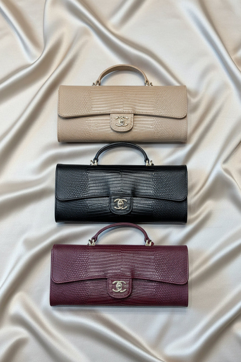 Lizard-embossed leather clutch