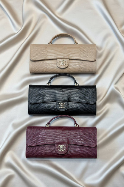 Lizard-embossed leather clutch