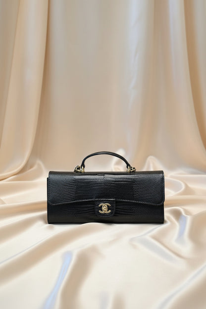 Lizard-embossed leather clutch