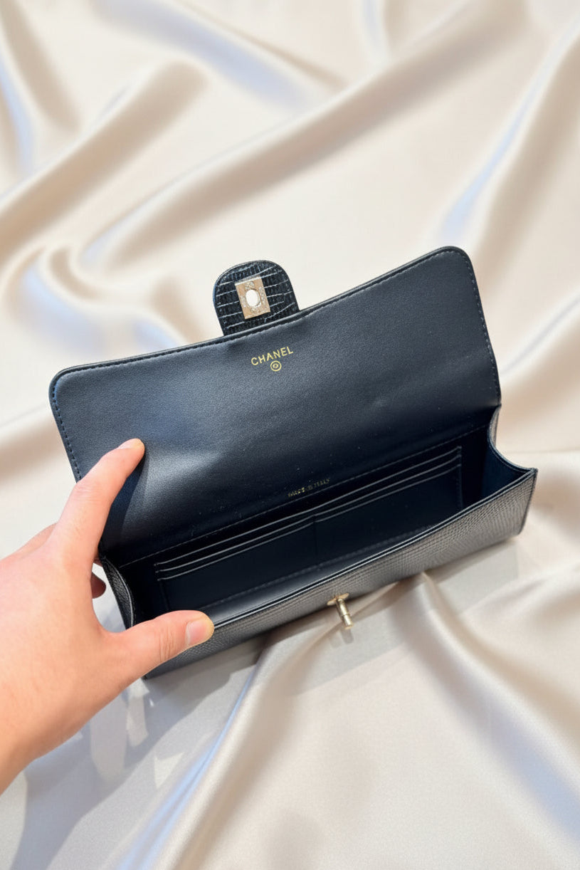 Lizard-embossed leather clutch