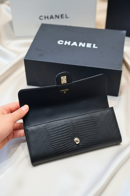 Lizard-embossed leather clutch